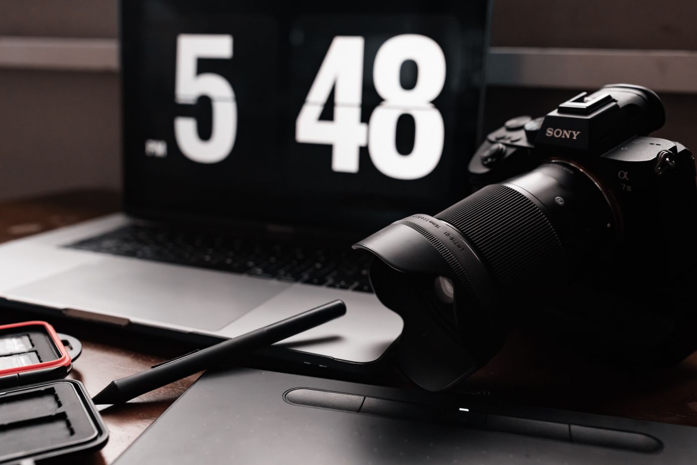 Camera and laptop on a desk