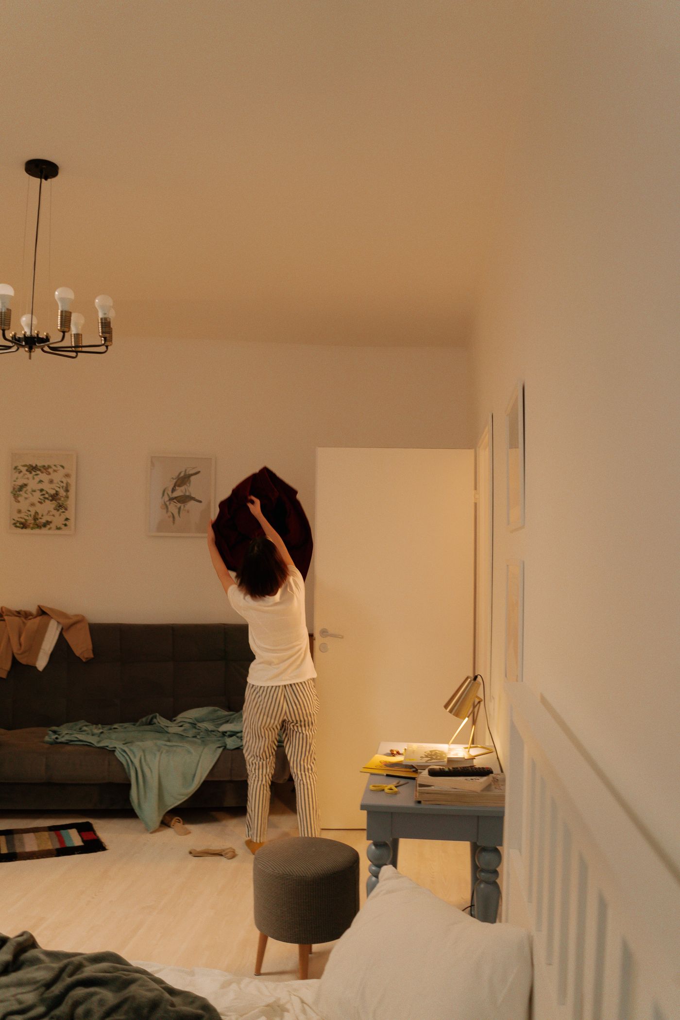 A person tidying a room