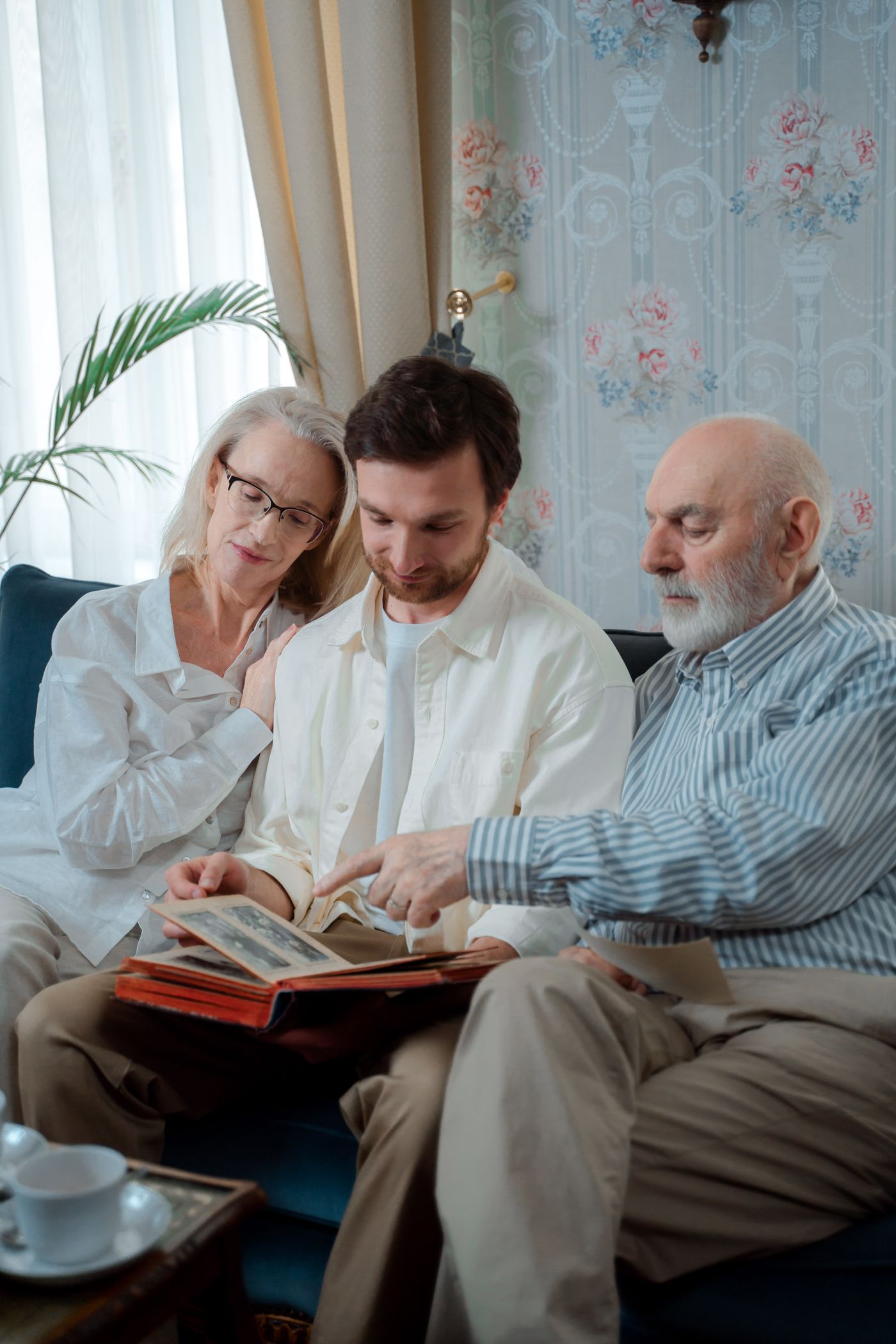 People looking through a photo album together